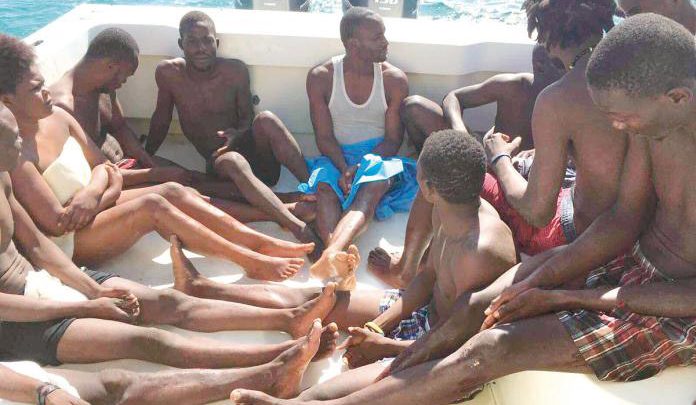 Haitian survivors rescued after their sloop ran aground on Saturday. Photo by Troy Pritchard